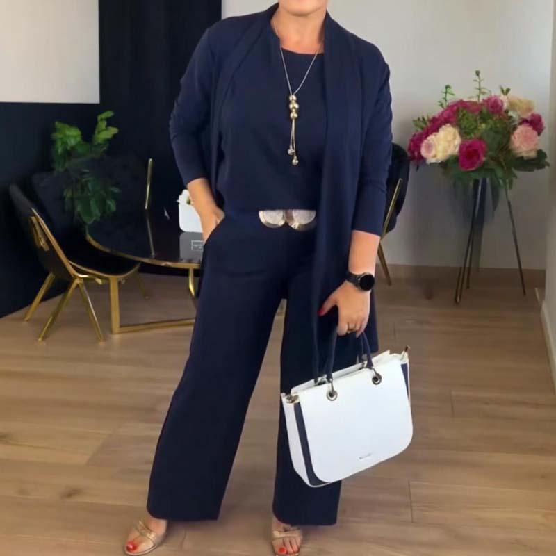 Elegant black 3-piece tailored set with sleek silhouette and luxurious fabric for polished versatility