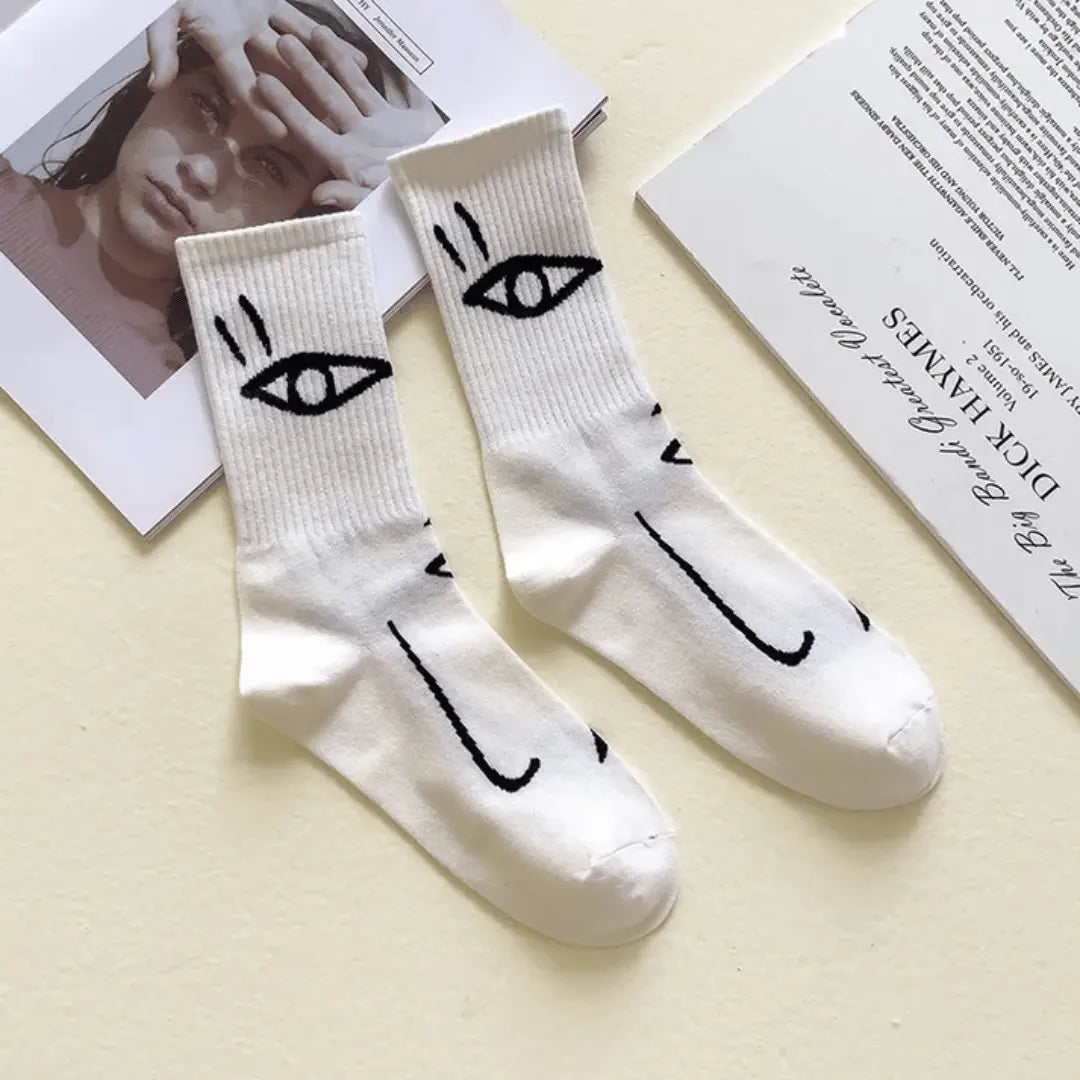 Multicolor abstract face art crew socks with bold expressive line art design for artistic everyday wear