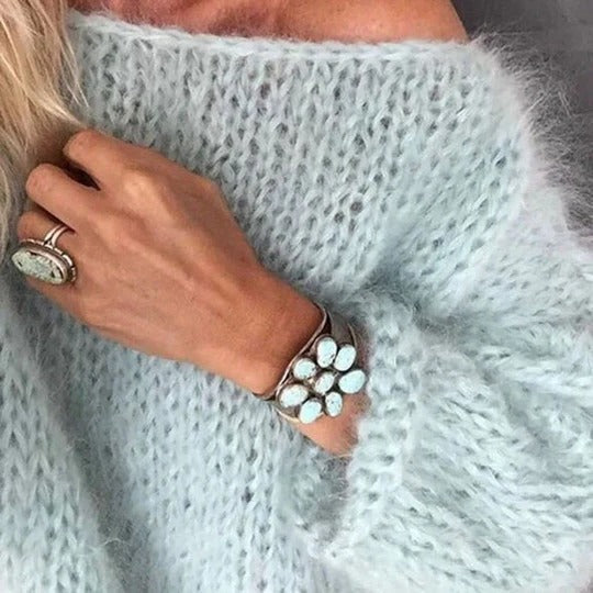 Relaxed-fit knitted sweater in neutral tone with clean silhouette for effortless everyday layering
