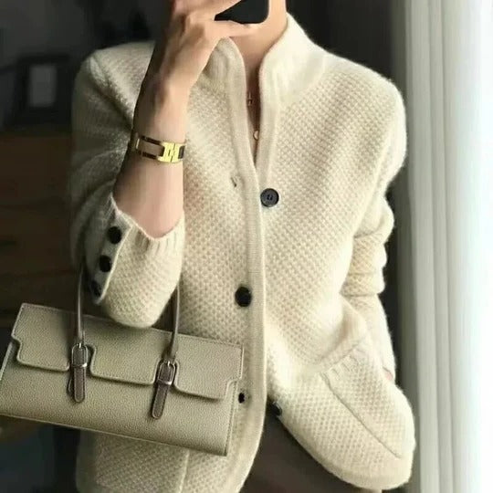 Soft gray unisex sweater jacket with structured fit and button-up closure for cold winter layering
