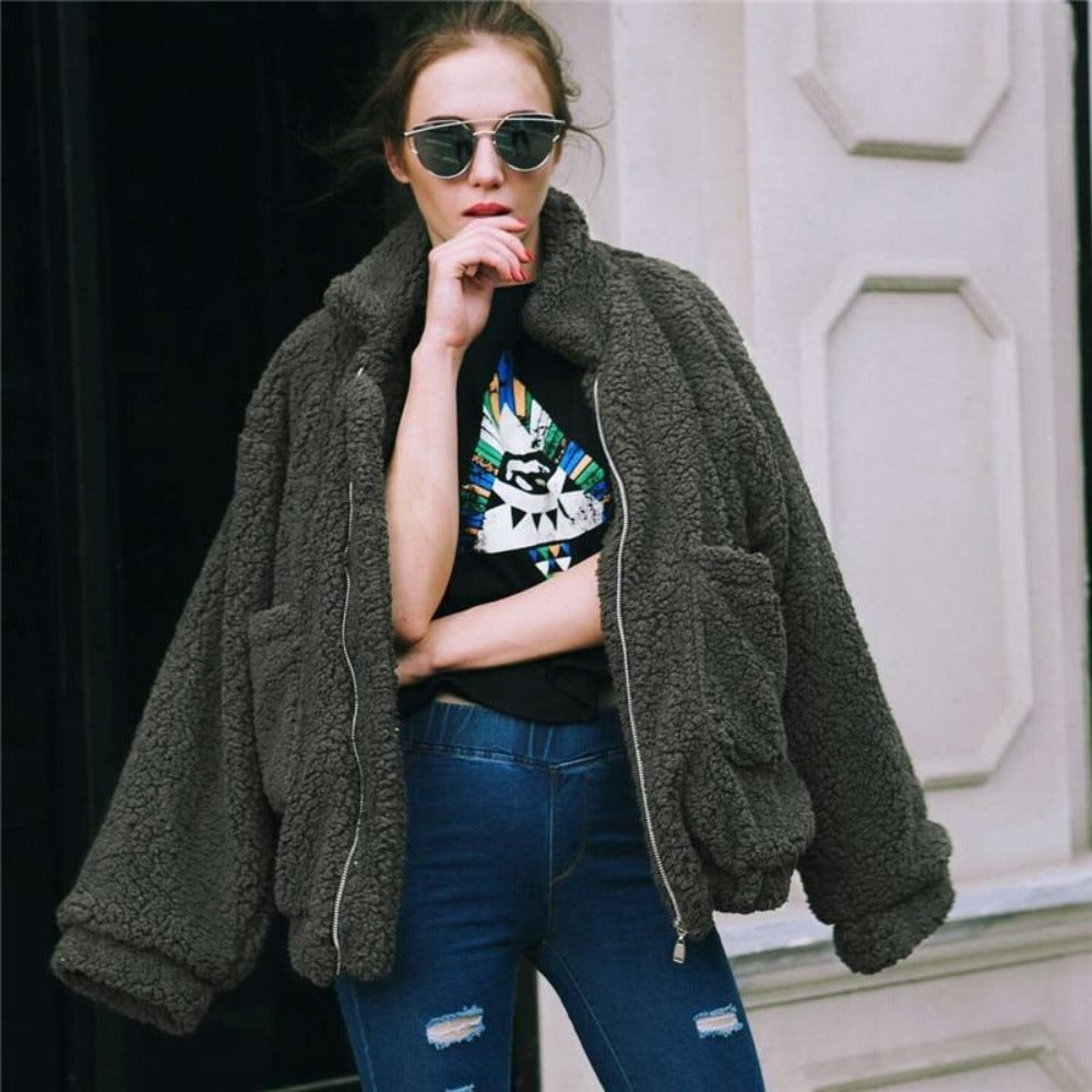 Women's oversized plush fleece coat with zip front and high collar in casual winter style
