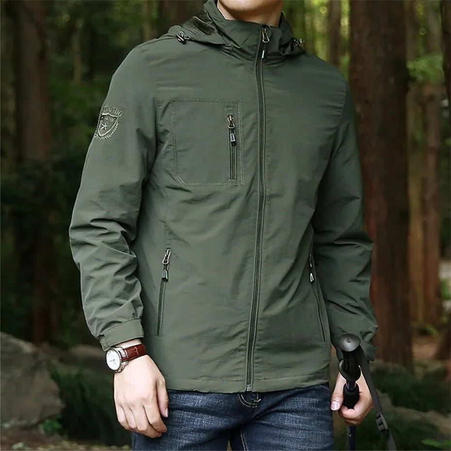 Lightweight waterproof adventure jacket in neutral tone, windproof hooded design for rainy outdoor trails