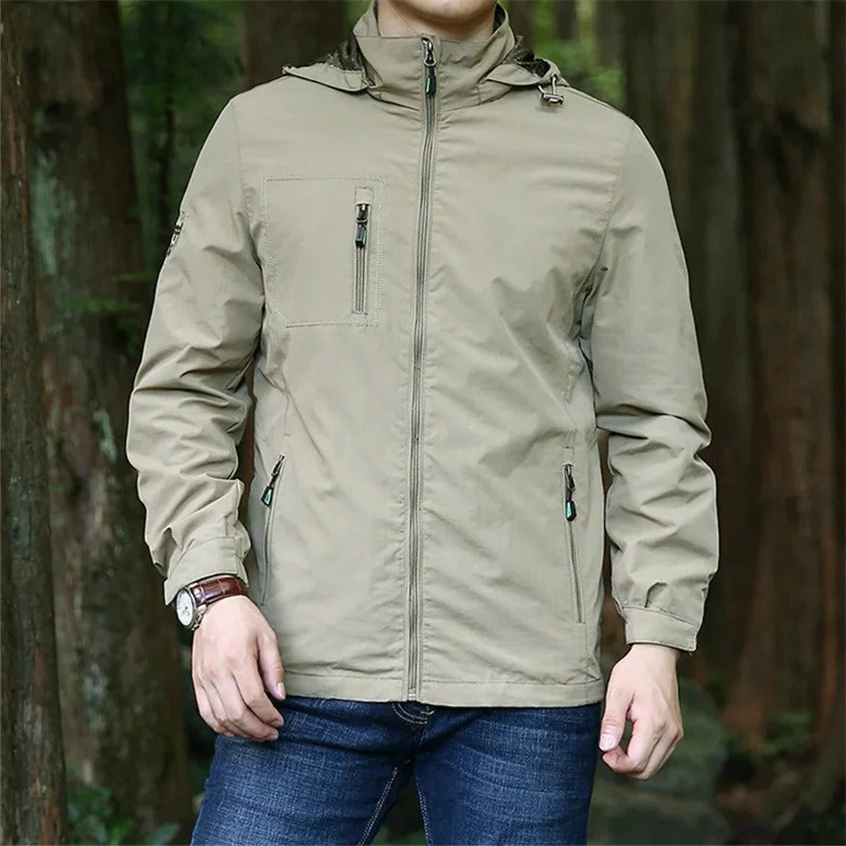 Lightweight waterproof adventure jacket in neutral tone with windproof protection for rainy outdoor days