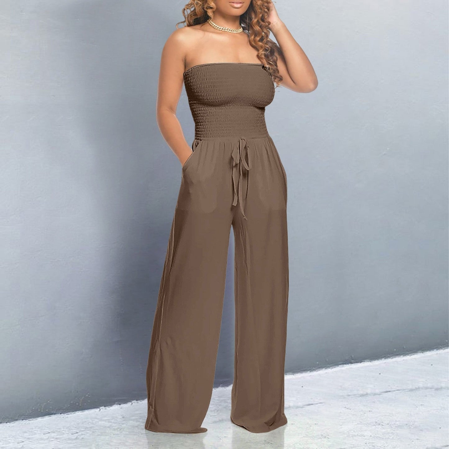 Black off-shoulder wide-leg jumpsuit with strapless form-fitting bodice and flowing elegant silhouette