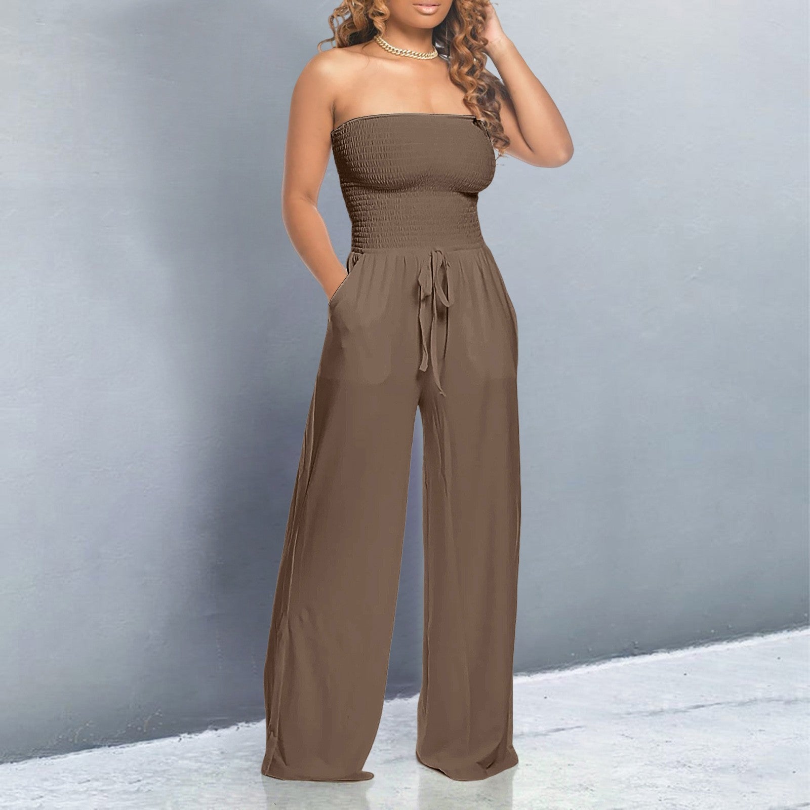 Black off-shoulder wide-leg jumpsuit with strapless form-fitting bodice and flowing elegant silhouette
