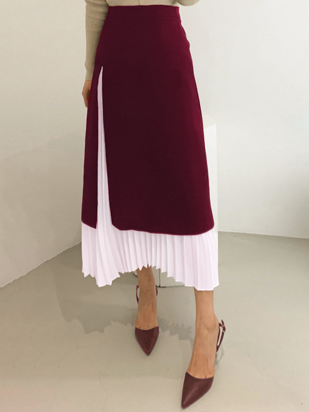 Black and white two-tone pleated long midi skirt with layered underlayer, elegant women's fashion