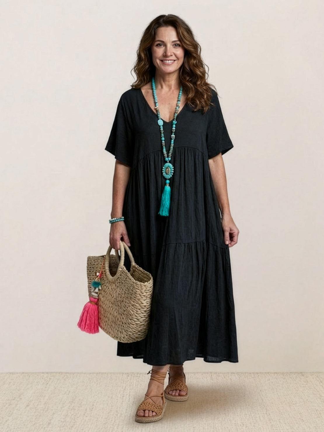 Terracotta women's V-neck tiered maxi swing dress with short sleeves and flowing bohemian silhouette