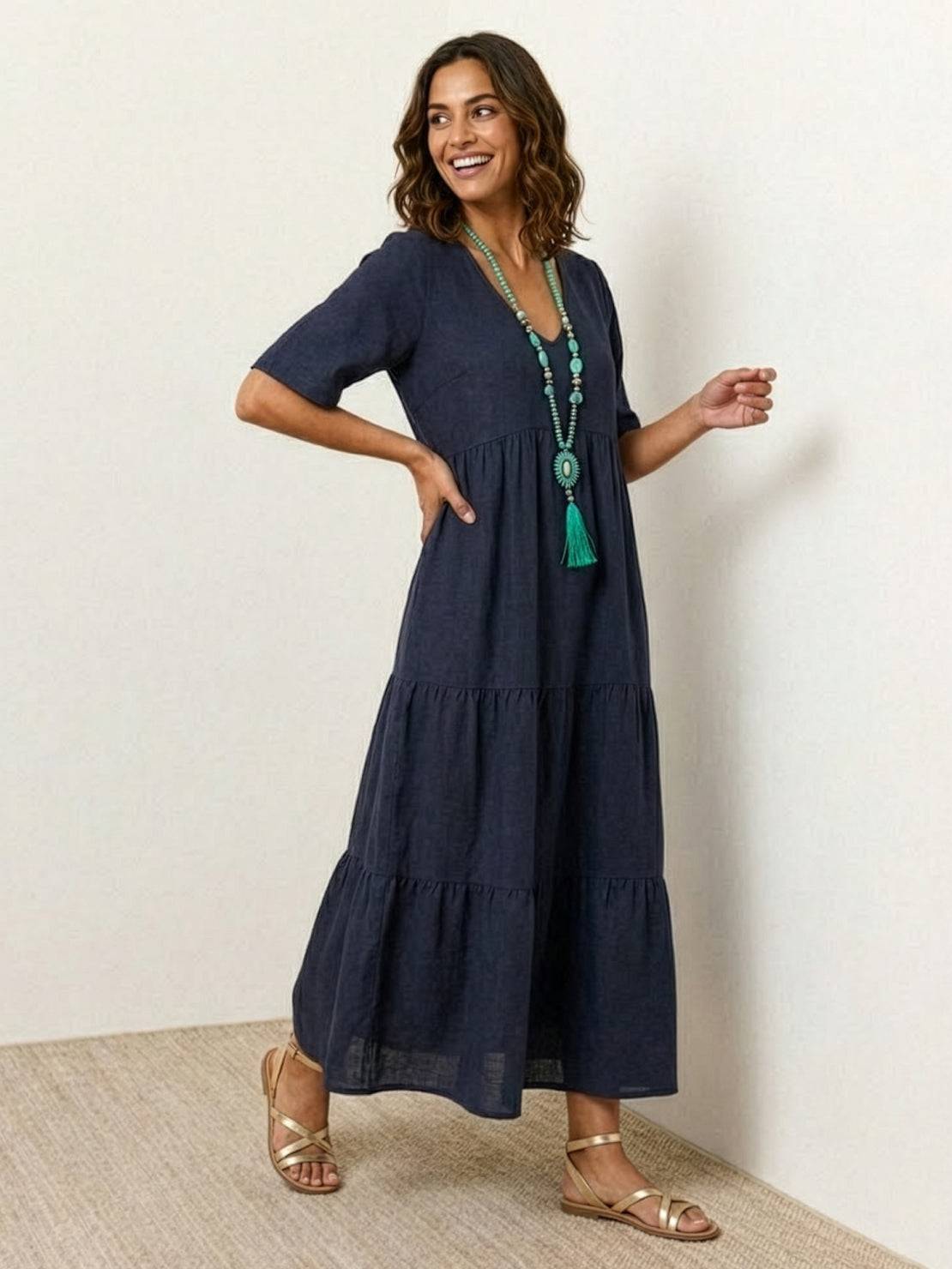 Terracotta women's V-neck tiered maxi swing dress with short sleeves and flowing bohemian silhouette