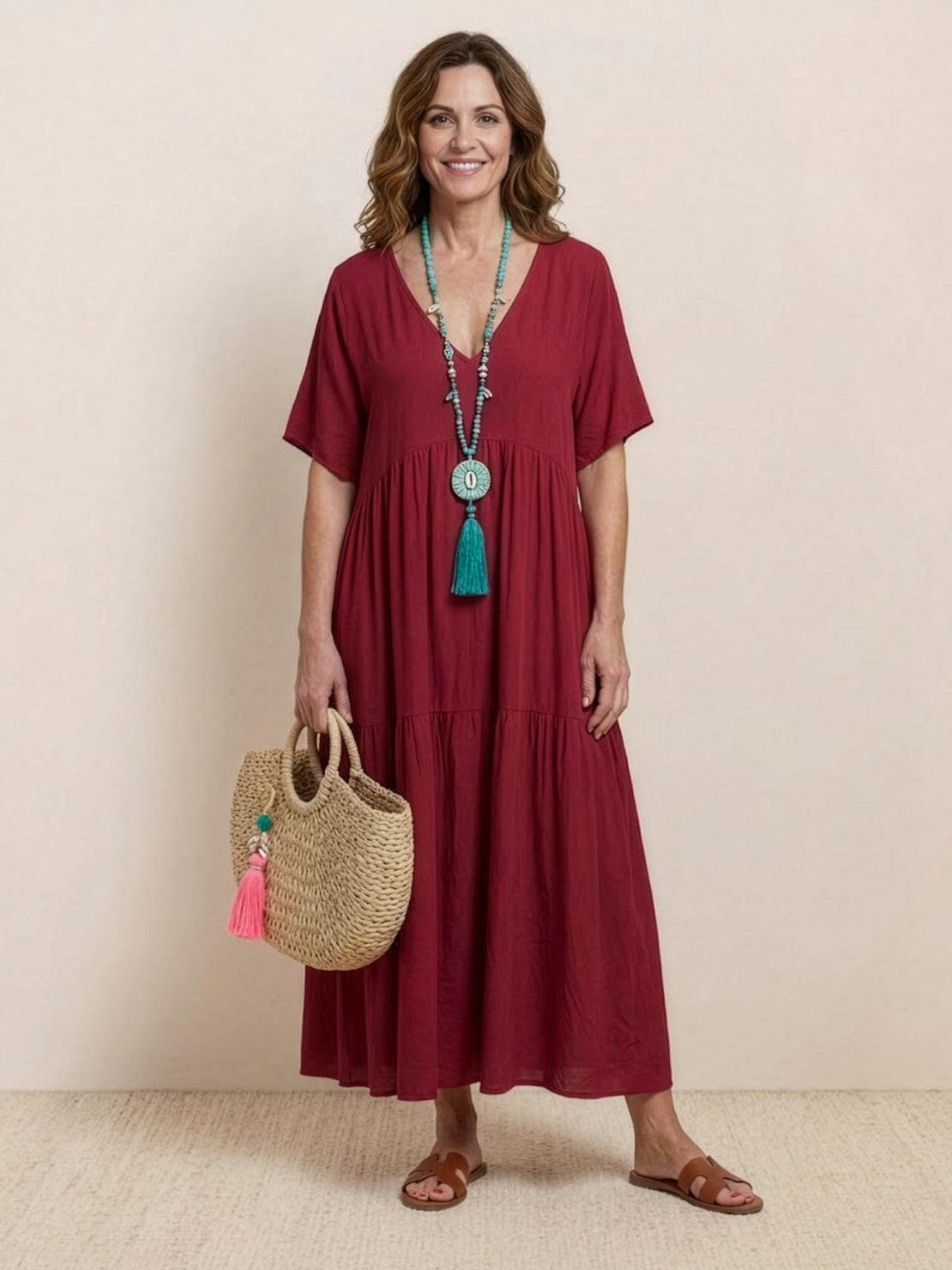 Terracotta tiered maxi swing dress with deep V-neck and short sleeves, bohemian two-tier silhouette