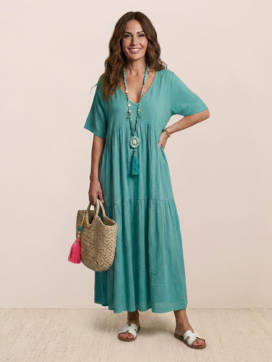 Terracotta women's V-neck tiered maxi swing dress with short sleeves and flowing bohemian silhouette