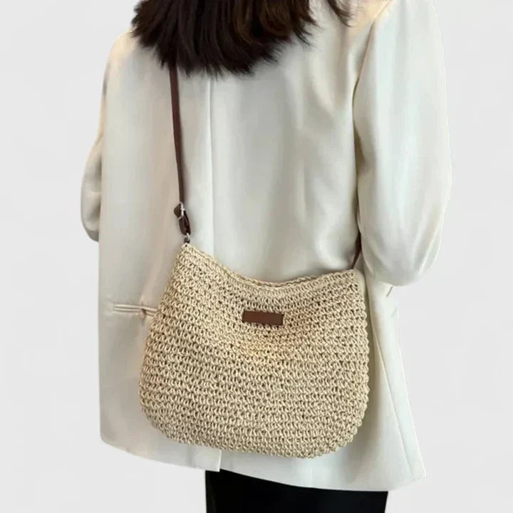 Natural woven shoulder bag with airy open-weave design and lightweight earth-tone finish