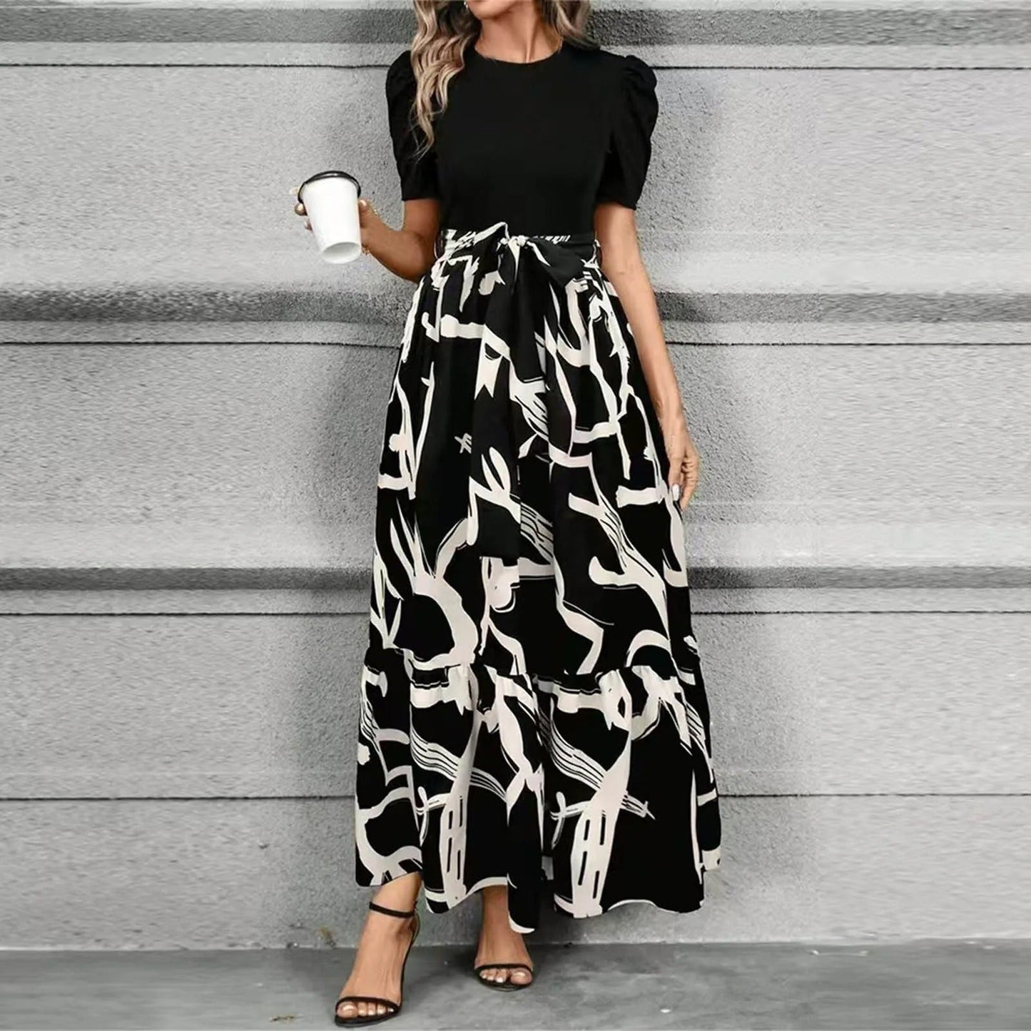 Black floral botanical print maxi dress high-waist A-line silhouette elegant garden party style