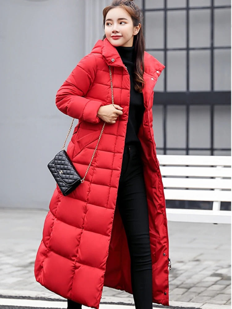 Women's long belted puffer coat with fur trim hood, quilted longline silhouette for winter warmth