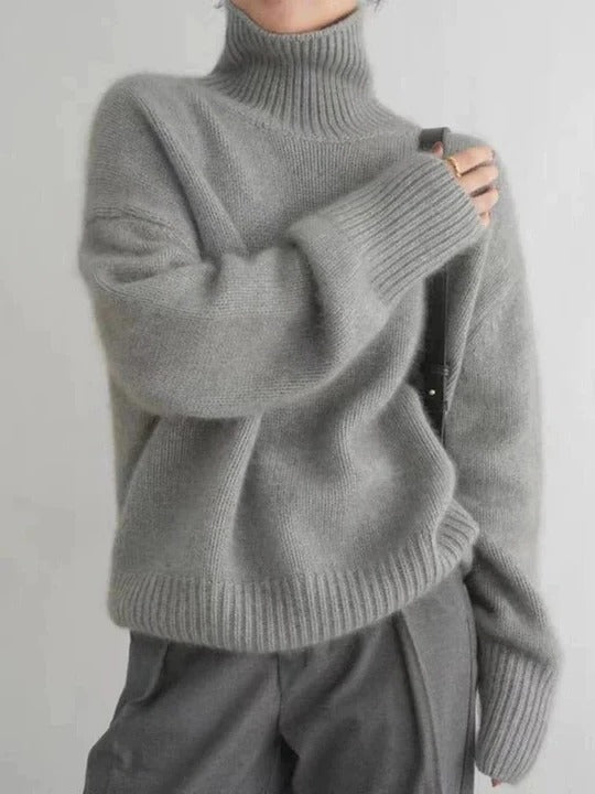 Ivory turtleneck sweater smooth uniform knit close fit minimalist silhouette for layering