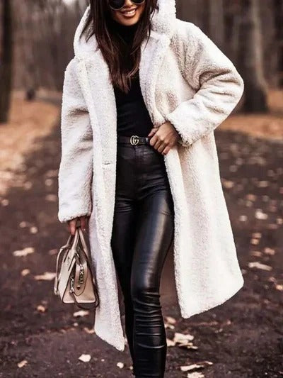Structured mid-length winter coat with high collar, button closure and waist belt for adjustable fit