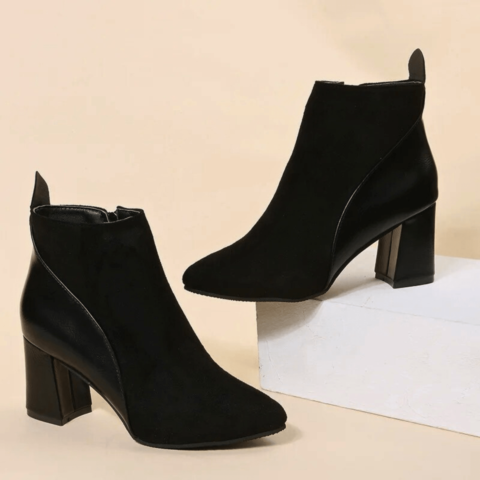 Valmont black pointed-toe booties with sleek contemporary silhouette for effortless modern elegance