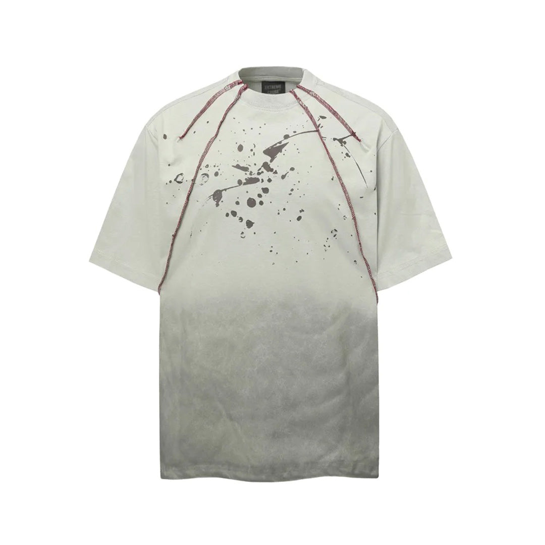 White cotton loose fit crew neck t-shirt with hand-printed paint splatter graphic distressed streetwear style