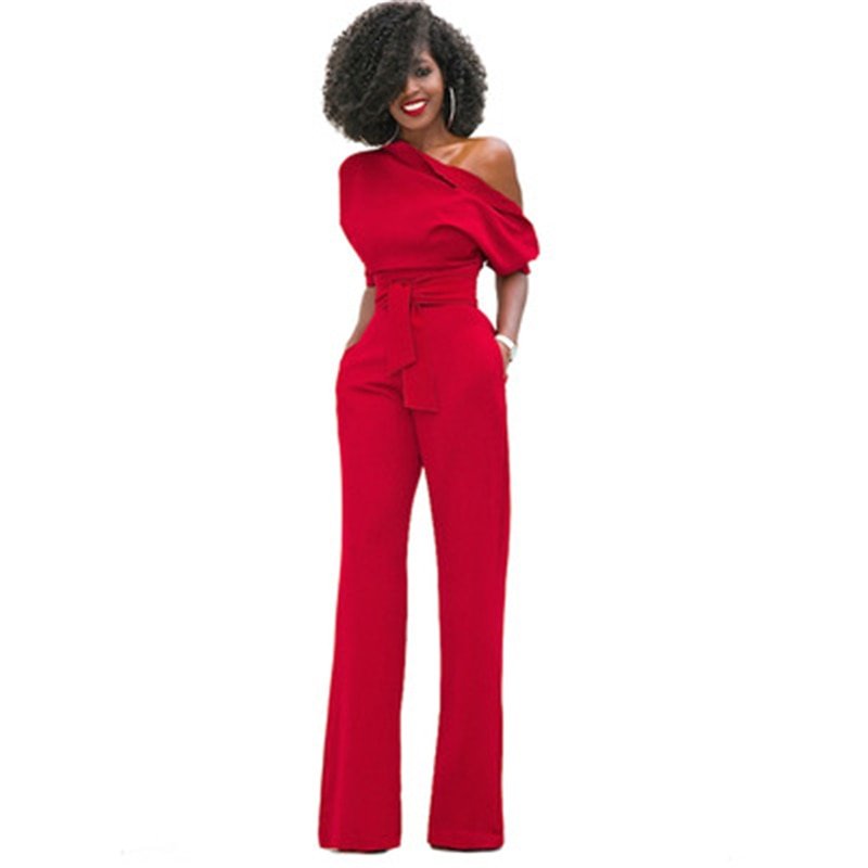 Red off-shoulder wide-leg jumpsuit with puff sleeve, belted waist, and floor-length formal silhouette