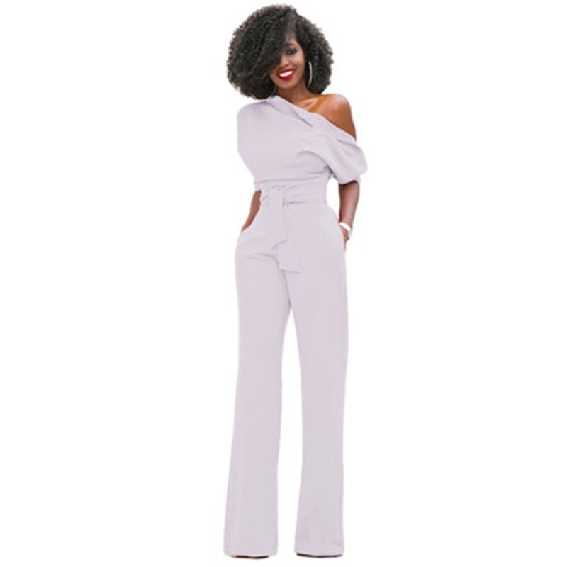 Red off-shoulder wide-leg jumpsuit with puff sleeve, belted waist, and asymmetric neckline for women