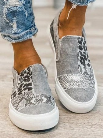 Women's white platform slip-on sneakers with cushioned sole and modern minimalist design