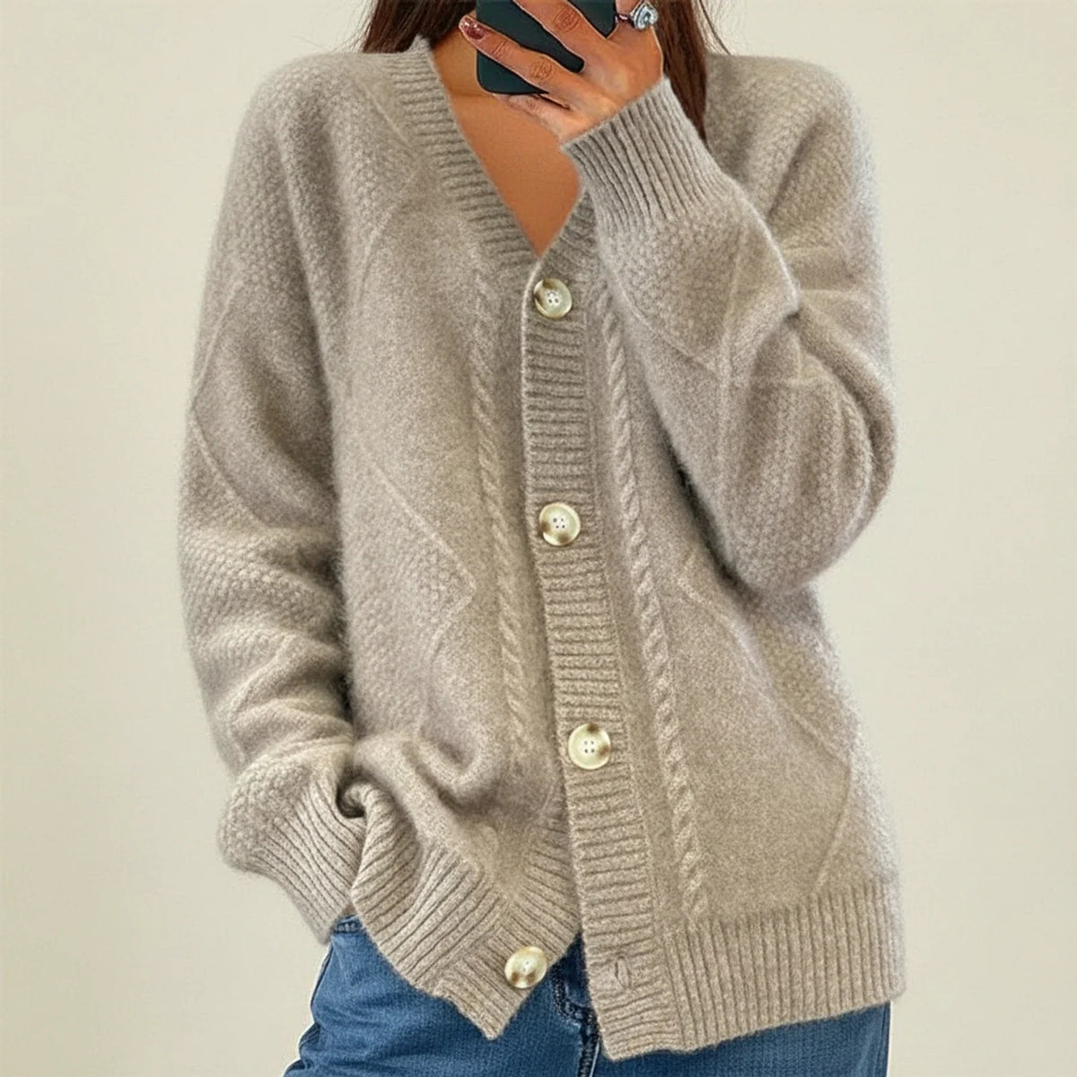 Soft pink cable knit cardigan with V-neck, button front closure, cozy everyday layering essential
