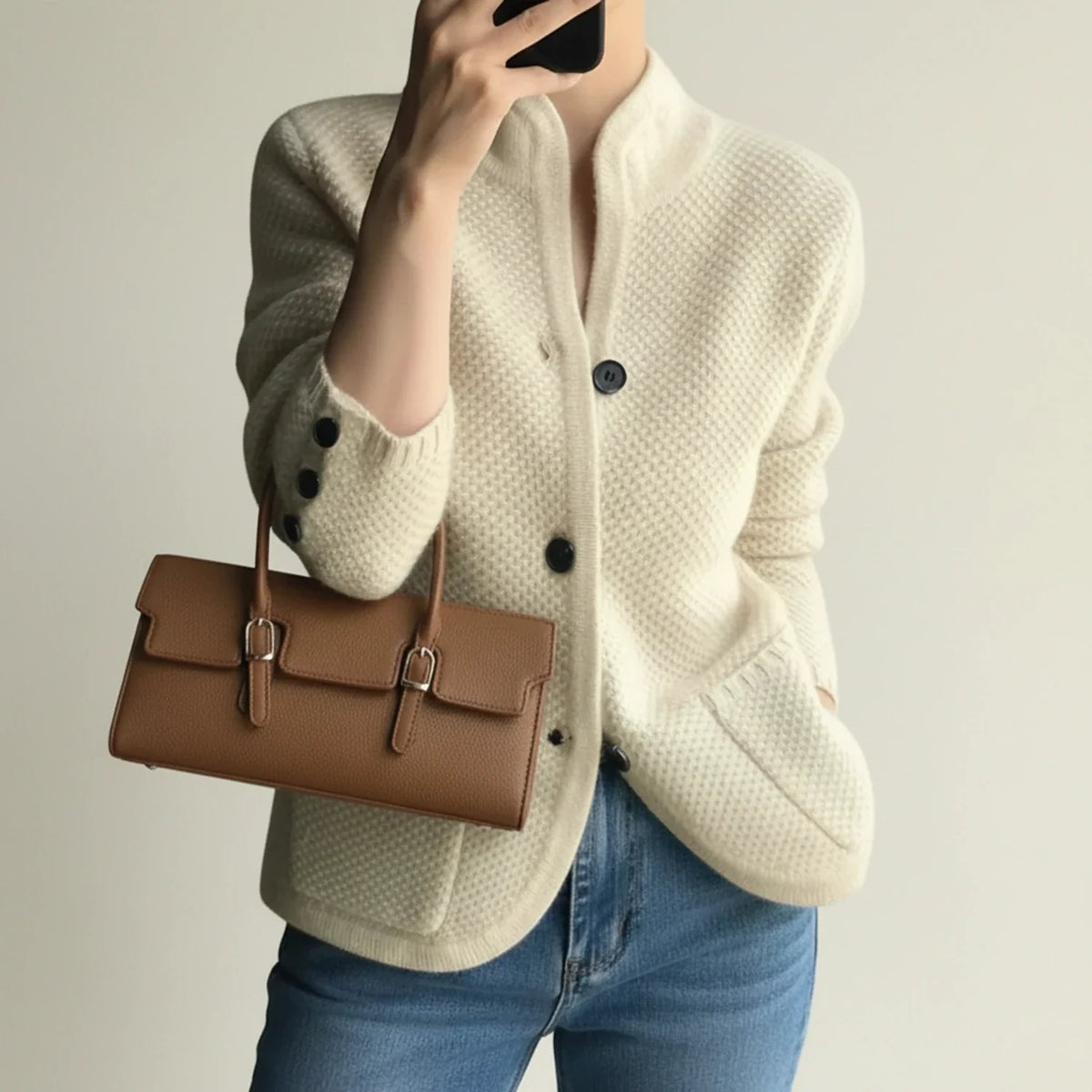 Women's textured knit cardigan jacket with stand collar, button-front, and front pockets for cozy layering