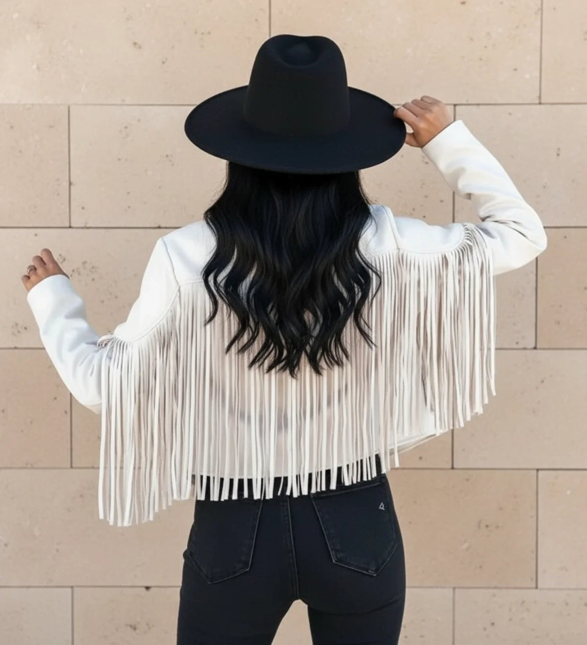Black cropped moto jacket with bold fringe detail, open front notch lapel, Western chic style