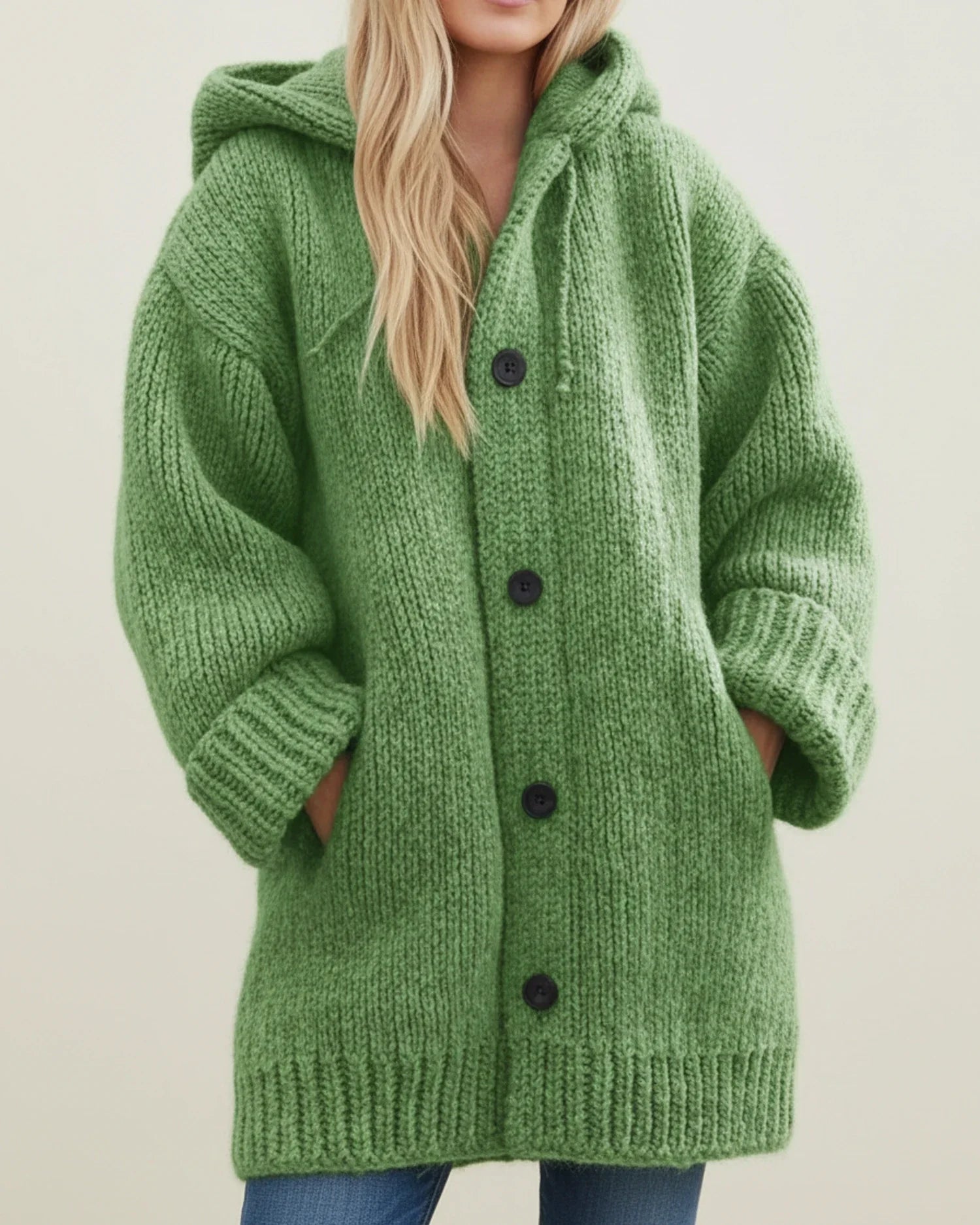 Women's oversized hooded knit cardigan jacket in cozy winter style with button-front closure