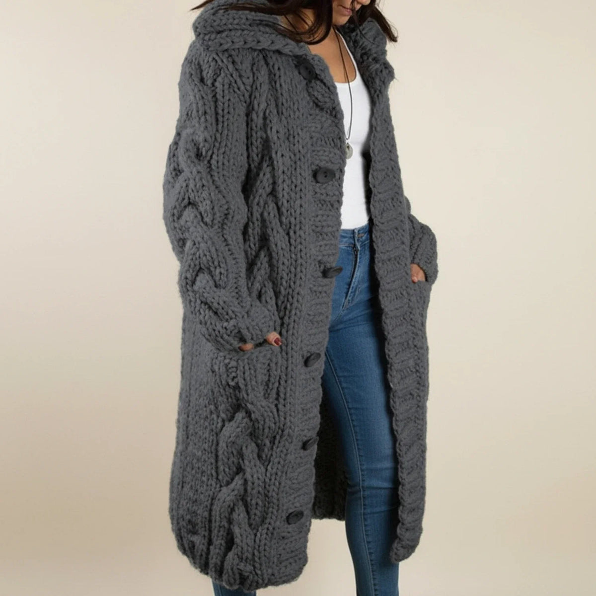 Women's cream cable knit hooded cardigan with button-front closure and long cozy silhouette