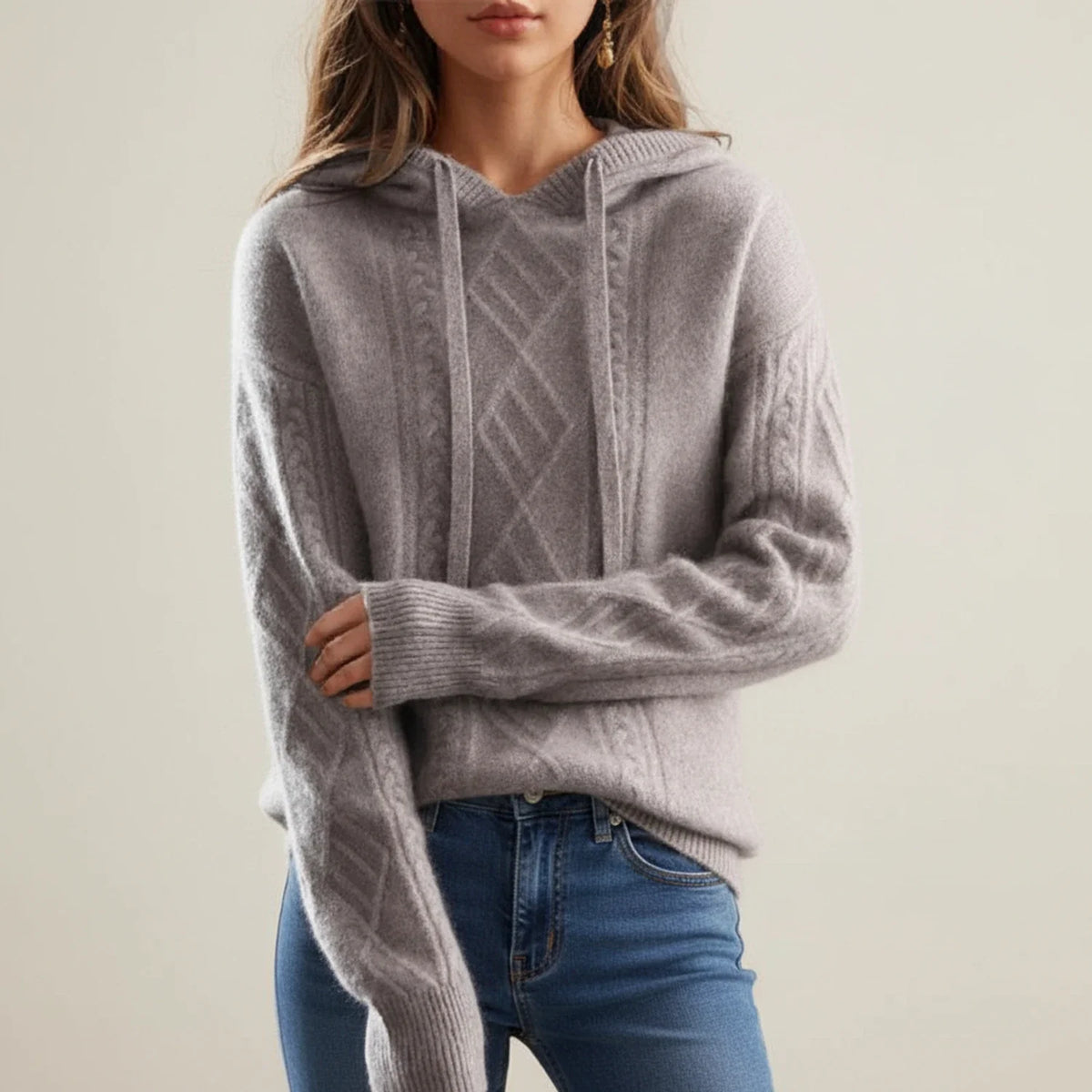 Women's cream cable knit hoodie sweater with relaxed fit and adjustable drawstring hood