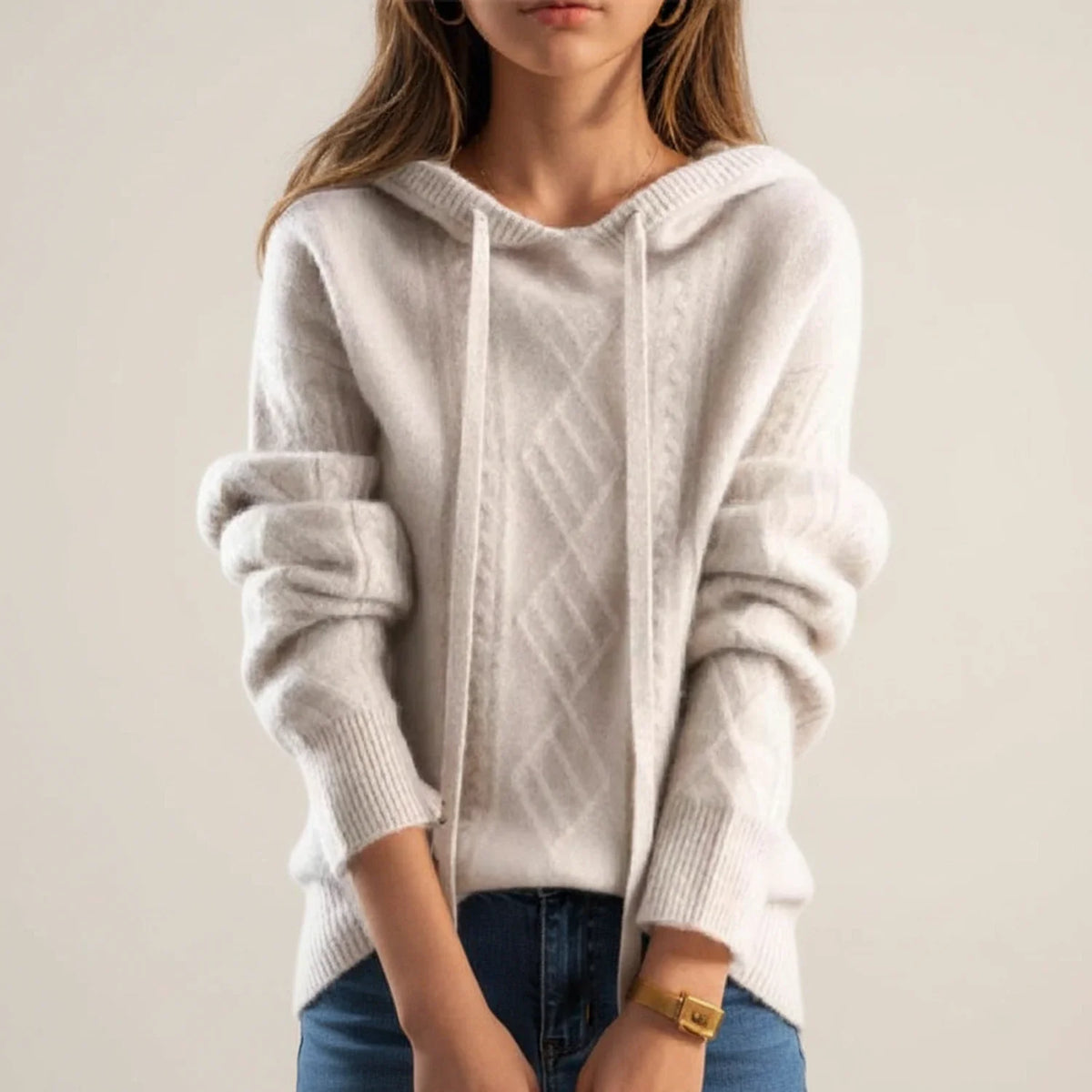 Women's cream cable knit hoodie sweater with relaxed fit and adjustable drawstring hood