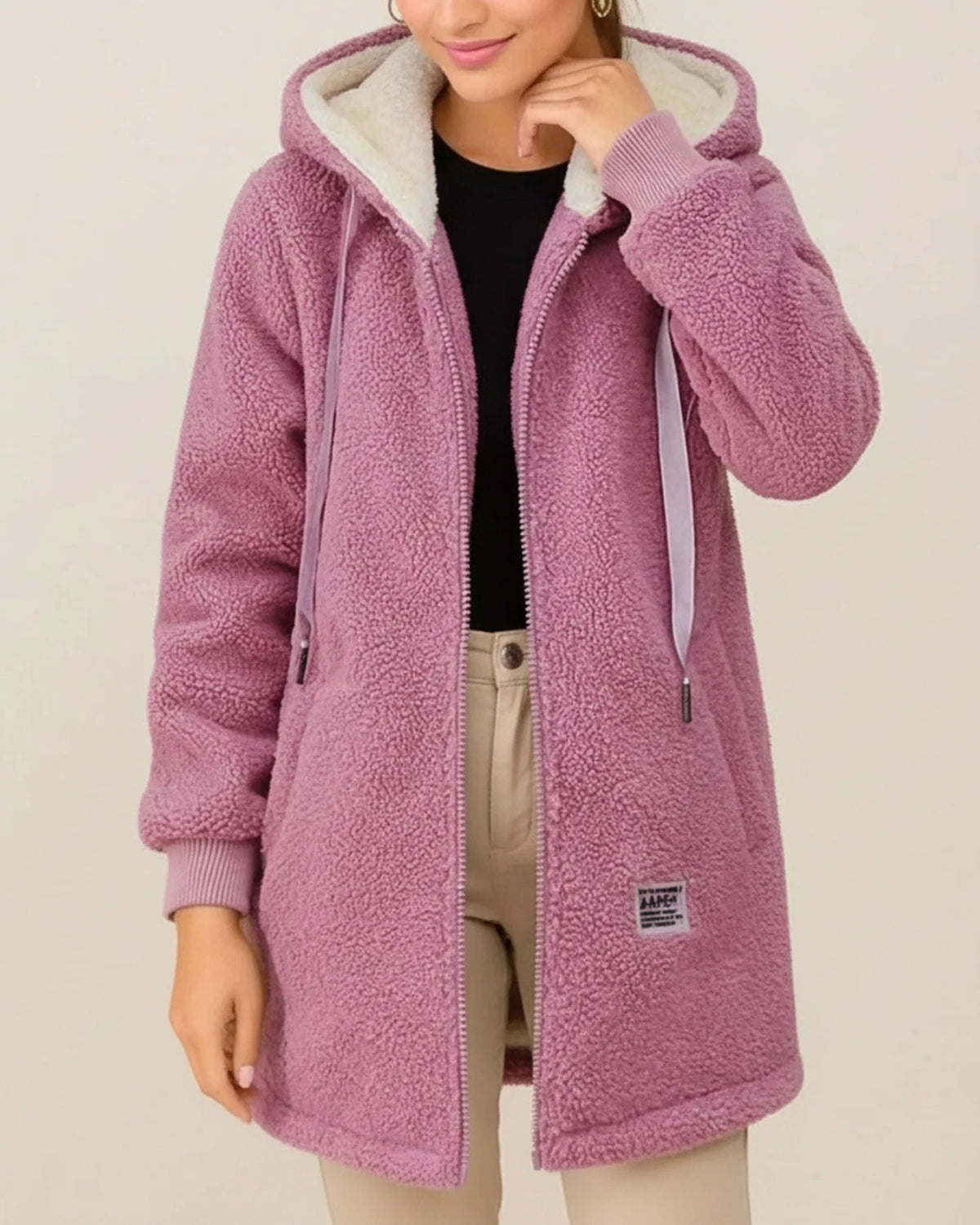 Women's longline hooded teddy coat with cozy fleece lining, zip-up front, and deep front pockets