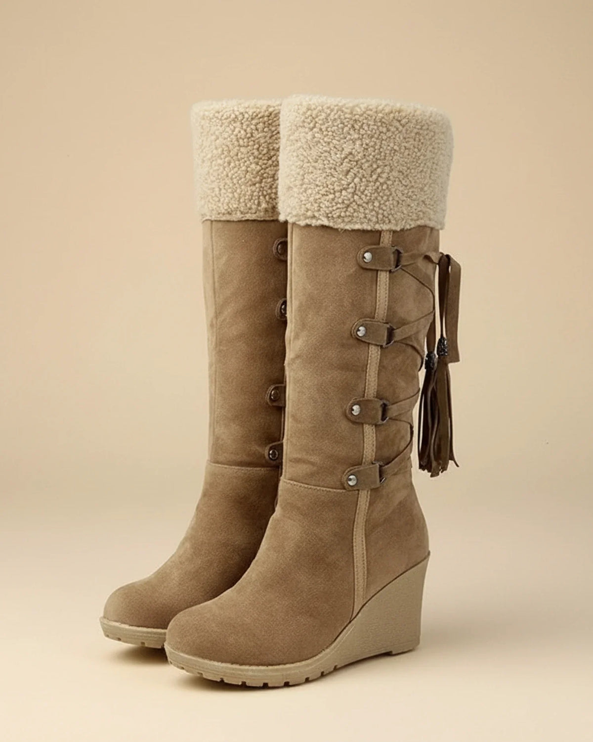 Women's knee-high winter wedge boots with faux fur trim, buckle and tassel accents
