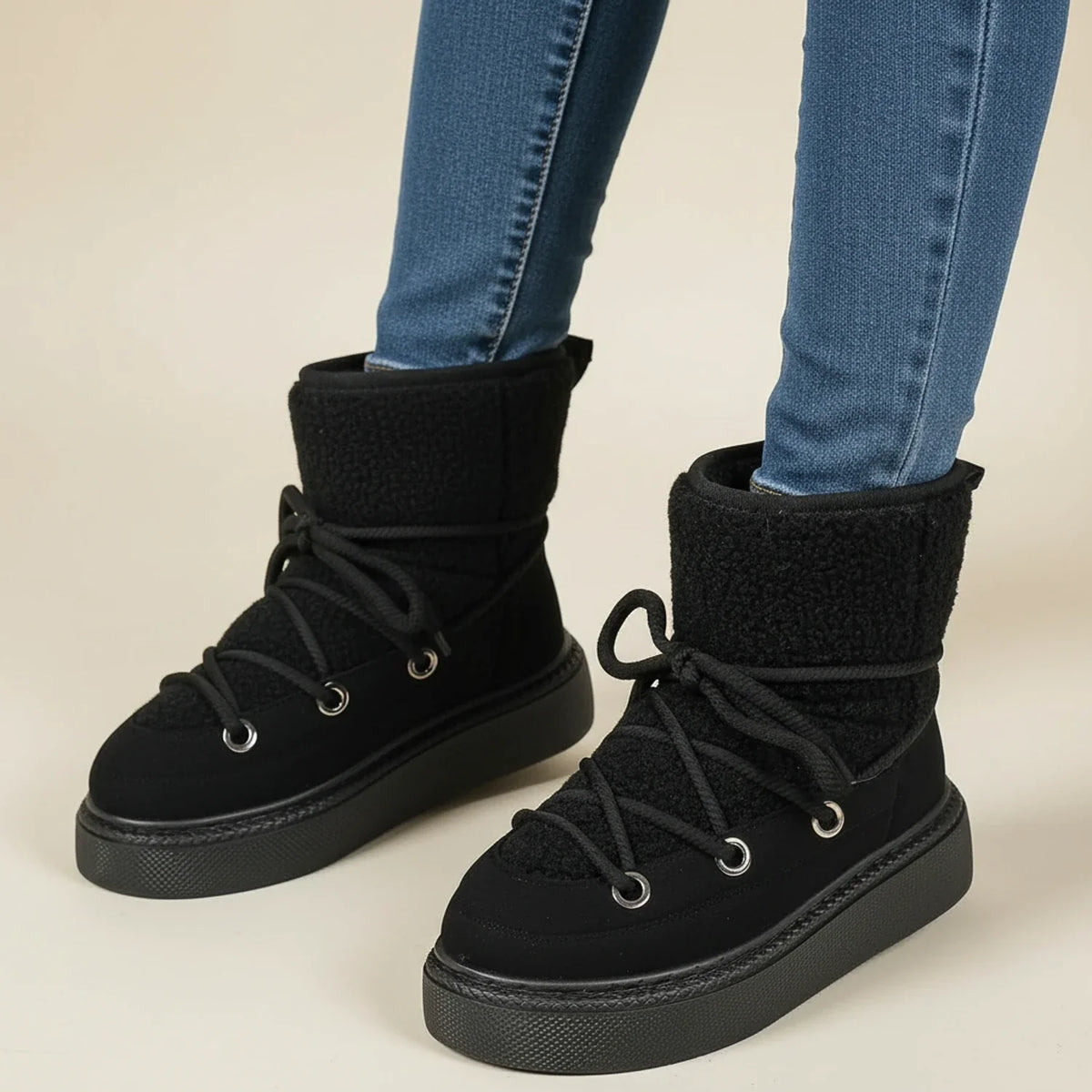 Women's black lace-up ankle winter boots with platform lug sole and round toe