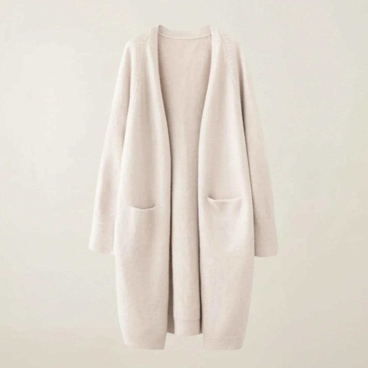 Women's longline open-front knit cardigan with patch pockets, relaxed cozy layering style