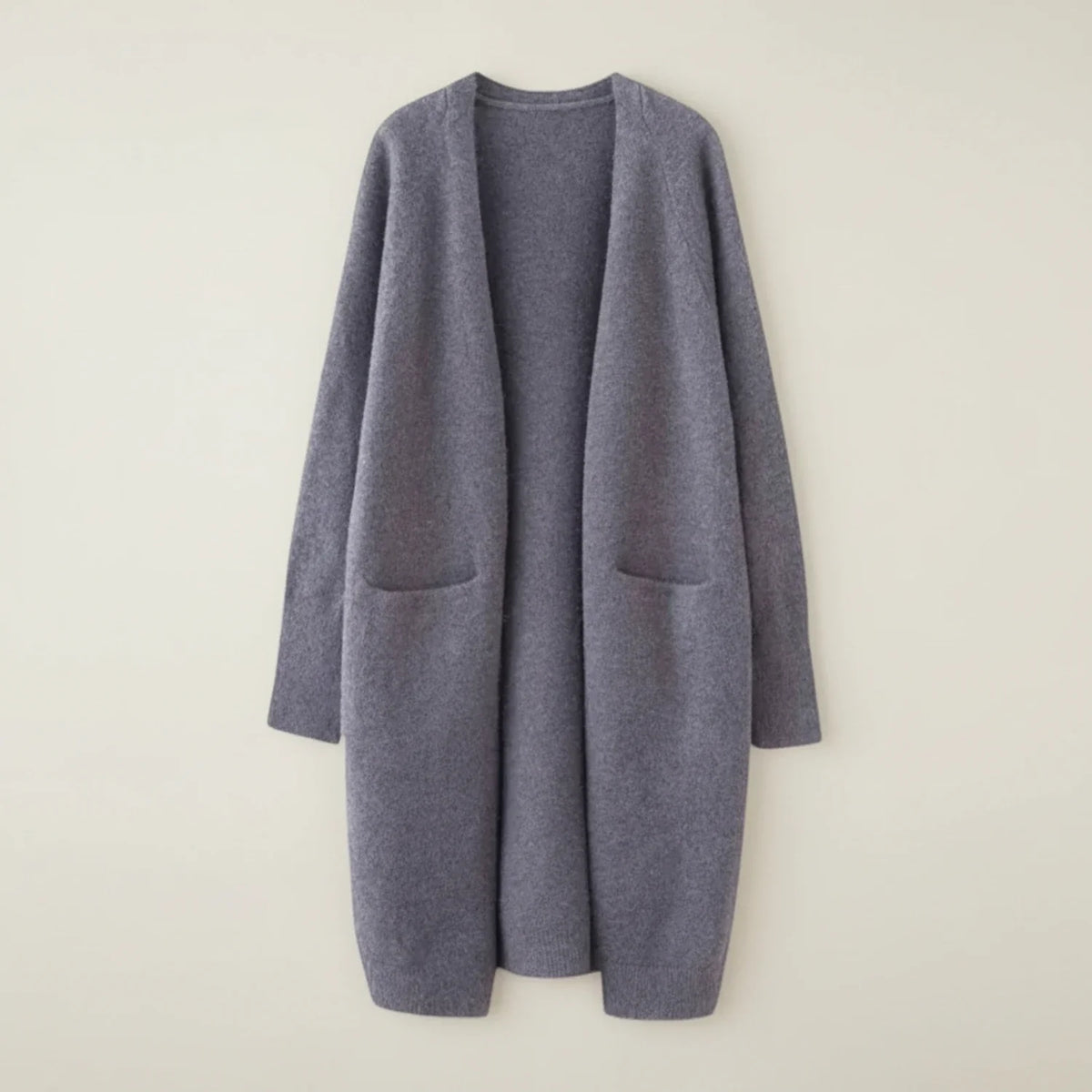 Women's longline open-front knit cardigan with patch pockets, relaxed cozy layering style