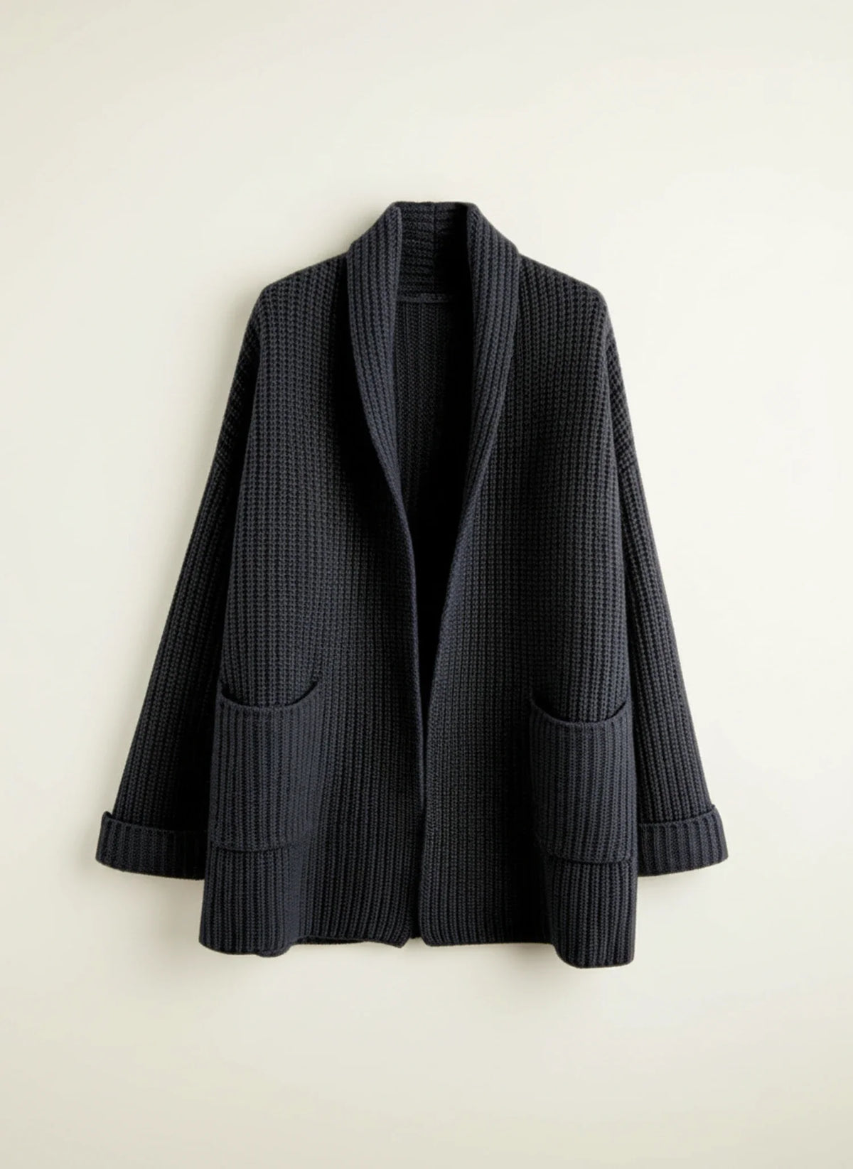 Women's oversized open-front knit cardigan with shawl collar and patch pockets cozy layering essential
