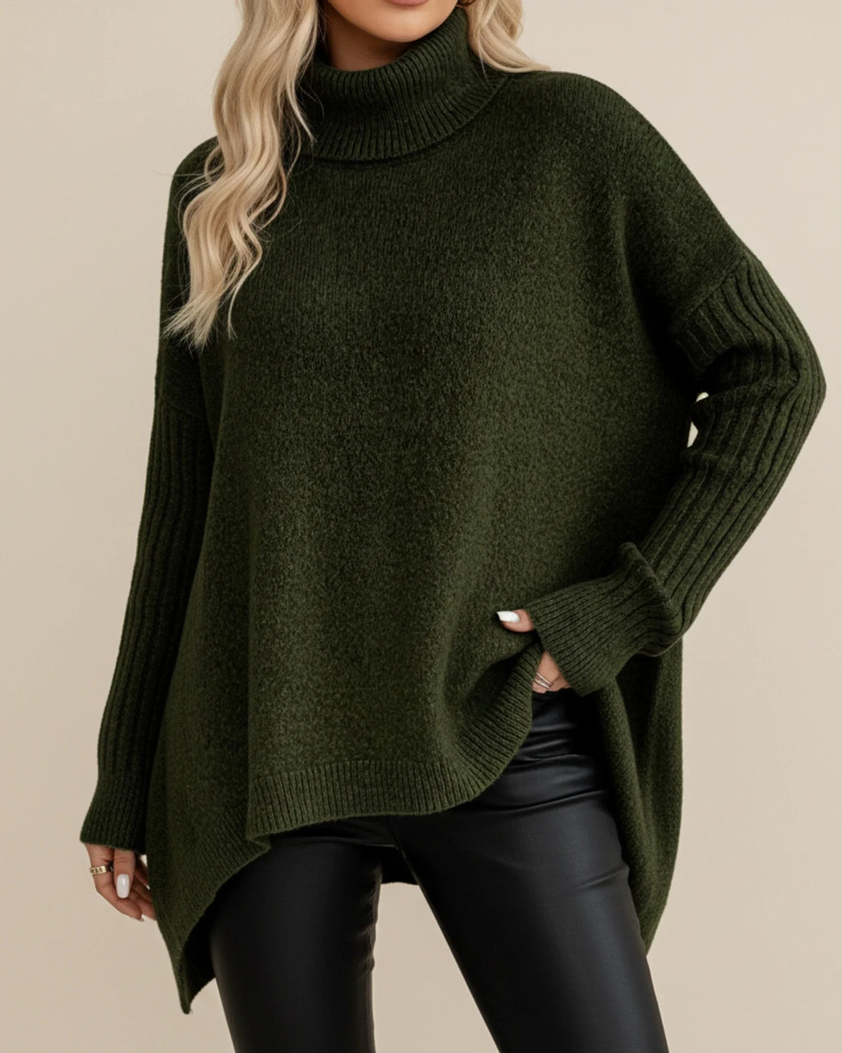Women's oversized ribbed knit turtleneck sweater with asymmetric hem for cozy winter layering