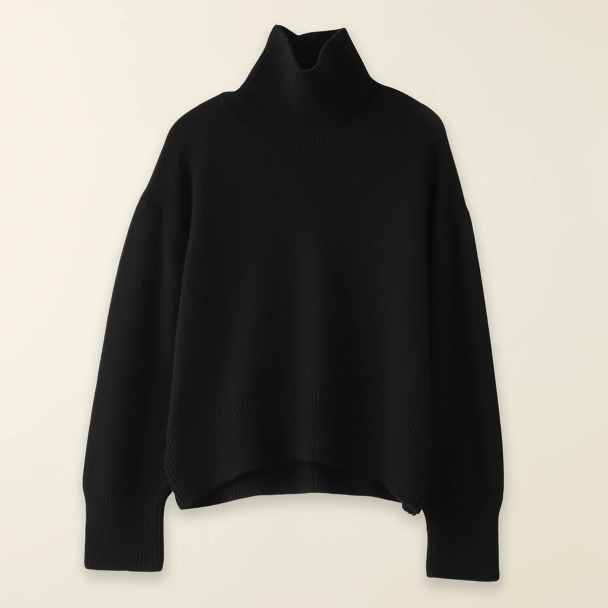 Women's oversized turtleneck knit sweater cozy hi-lo hem drop shoulder ribbed texture layering essential