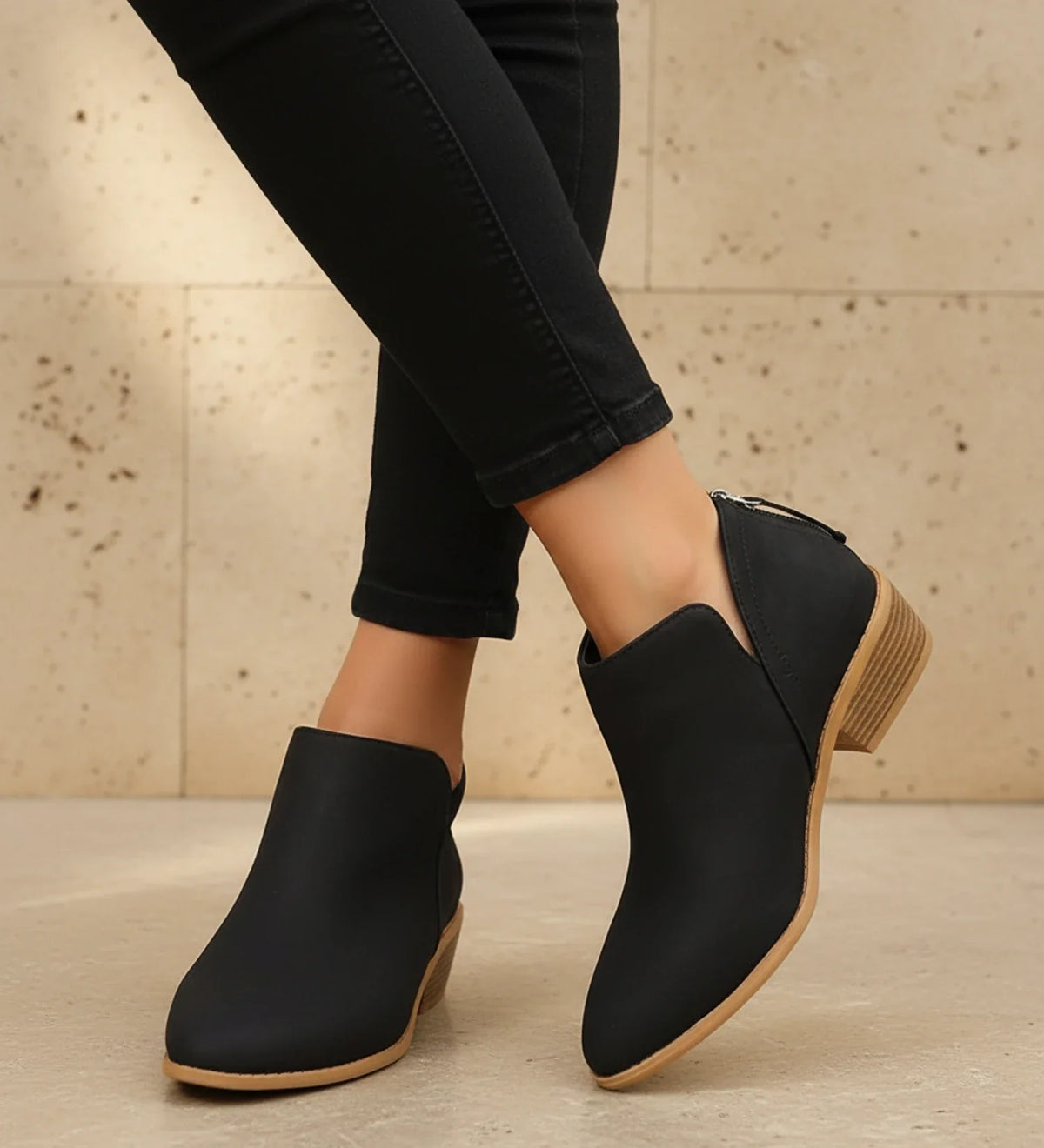 Women's black pointed toe ankle boots with chic V-cutout, sleek silhouette for elevated everyday style