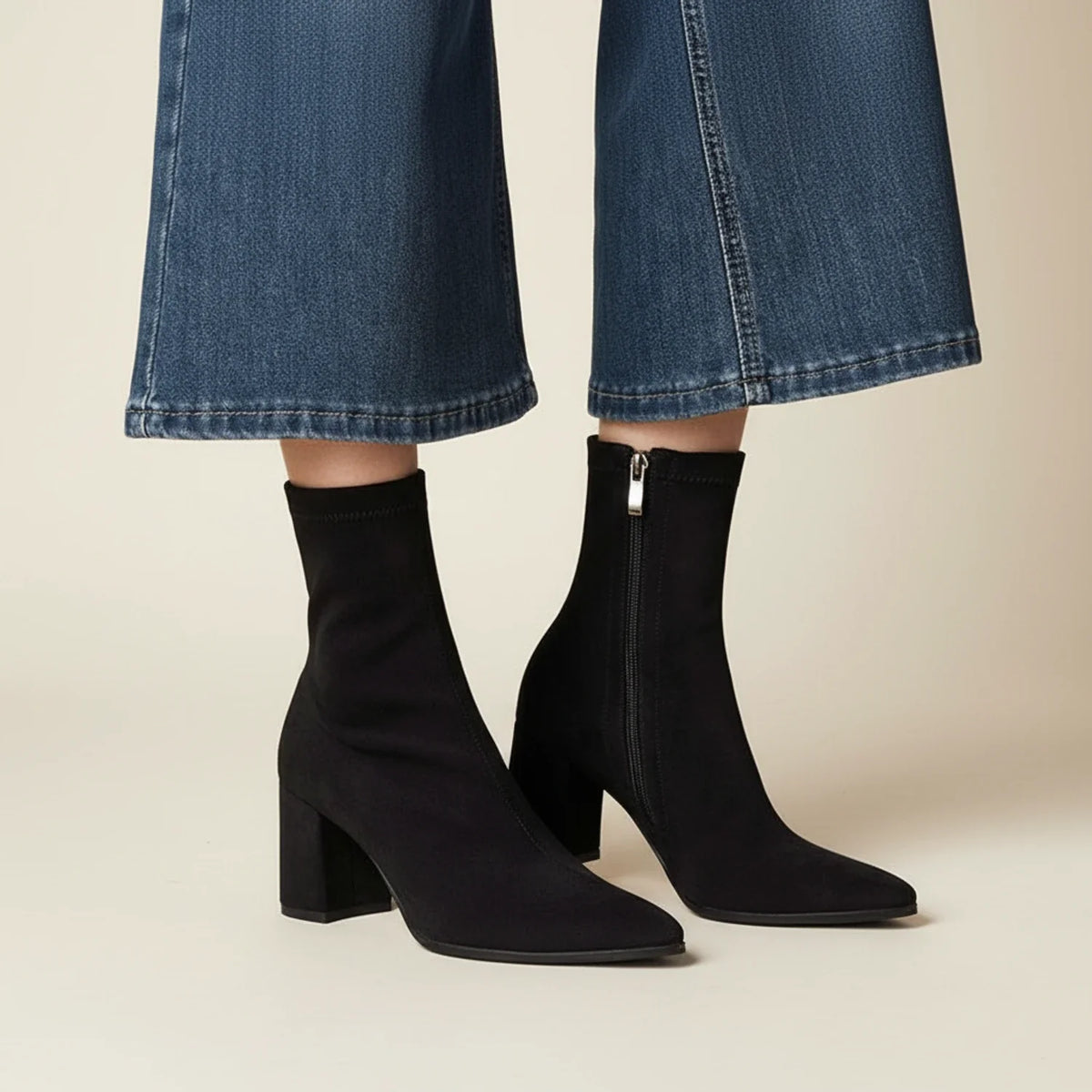 Women's suede ankle boots in neutral tone, sleek silhouette with luxurious soft texture for versatile styling