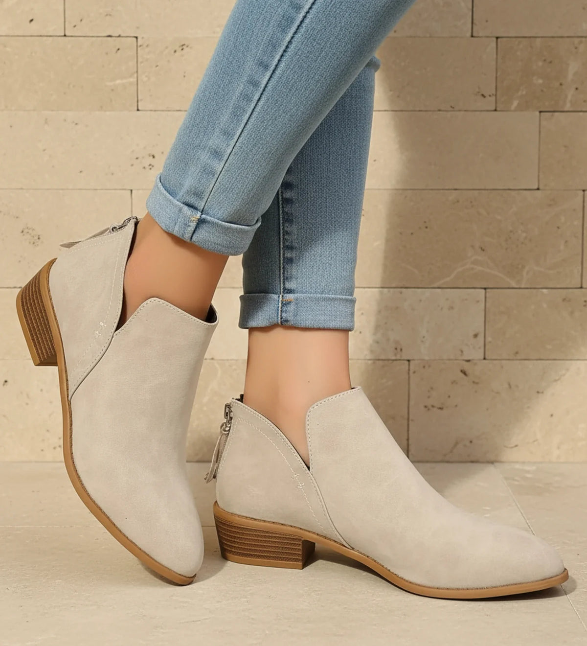 Women's black pointed toe ankle boots with V-cutout detail, sleek silhouette for elevated everyday wear