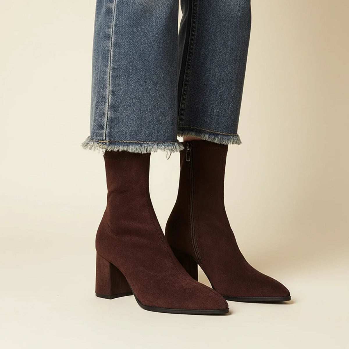 Women's suede ankle boots in neutral tone, sleek silhouette with luxurious soft texture for polished everyday style