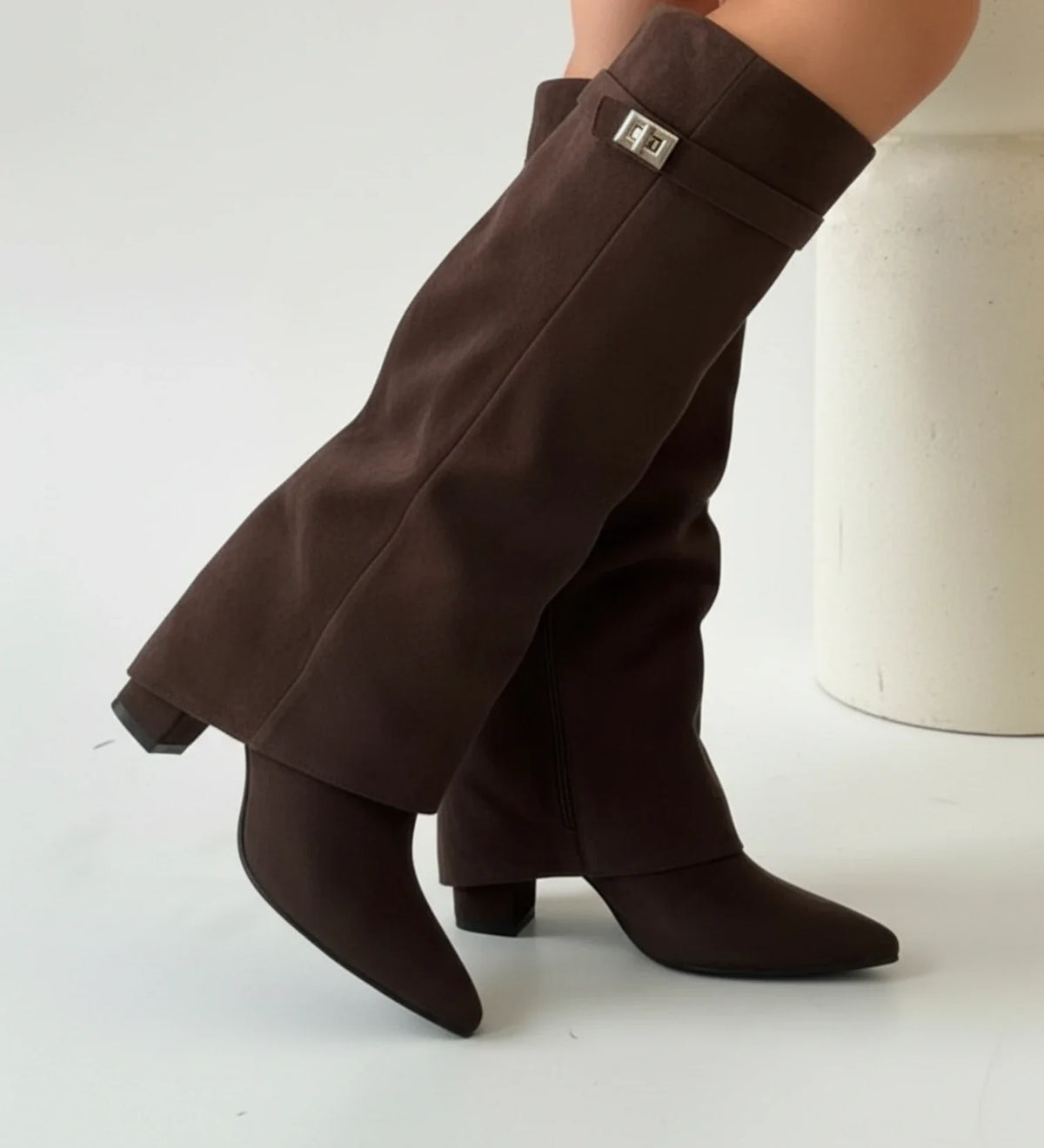 Women's black knee-high slouch pull-on boots with pointed toe, relaxed shaft, over-the-knee silhouette