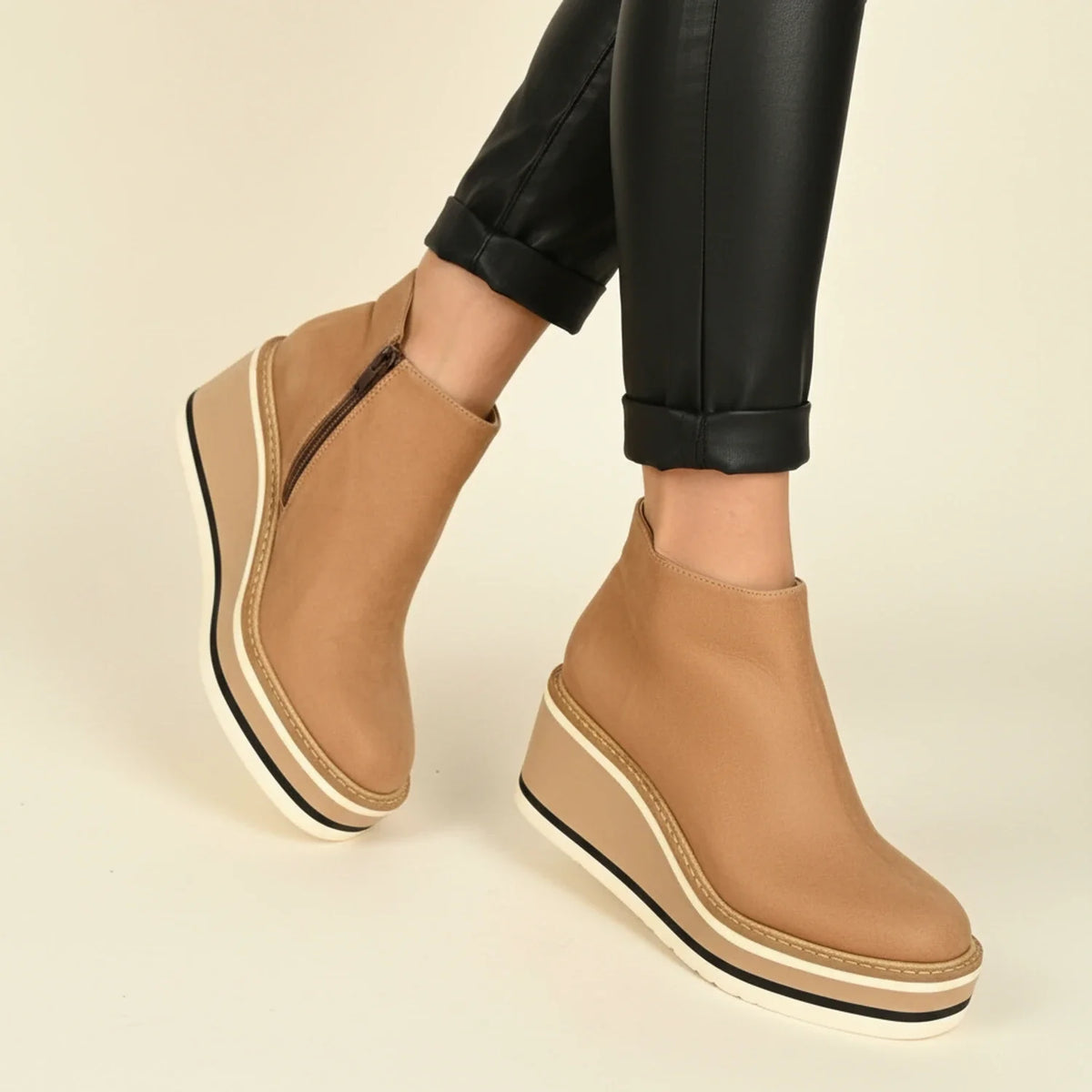 Women's brown leather wedge boots with platform sole, polished silhouette and all-day comfort