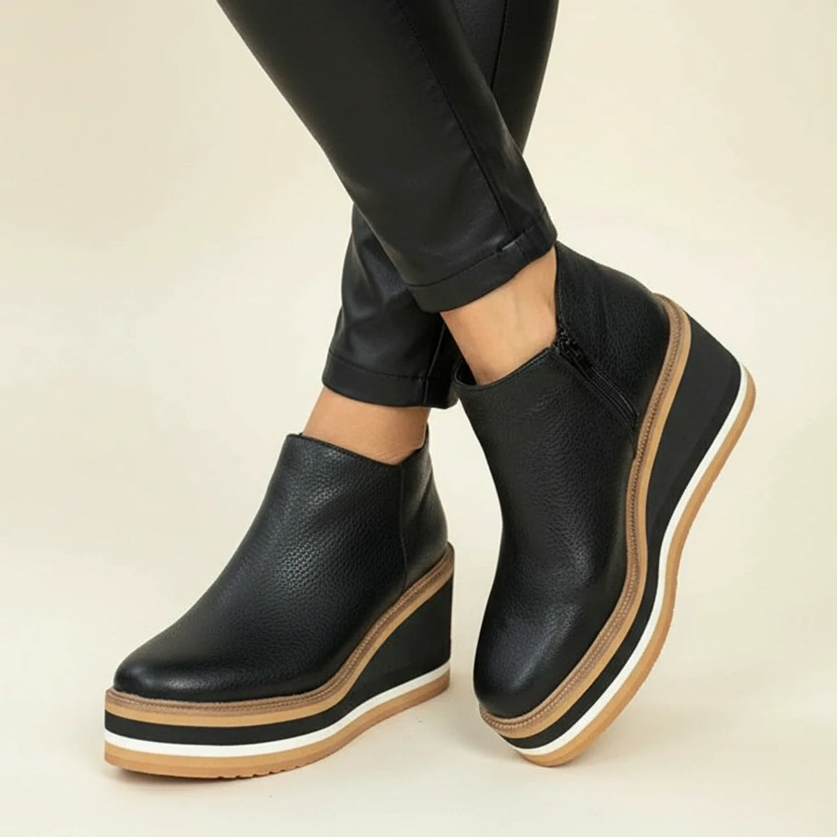 Women's brown leather wedge boots with platform sole, polished silhouette and all-day comfort