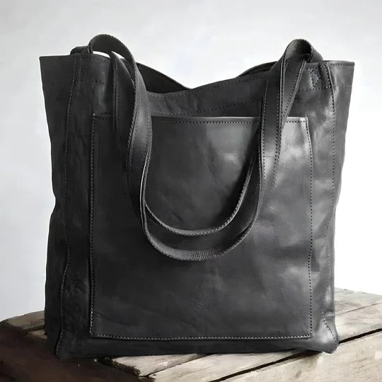 Women's elegant leather satchel tote bag in classic brown with roomy interior and structured silhouette