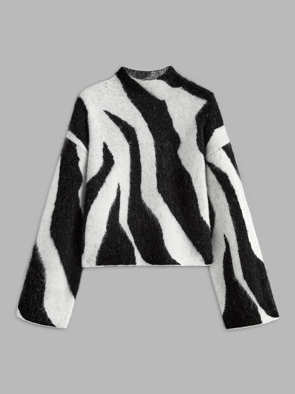 Leopard print wool-blend fuzzy sweater in warm neutral tones with shift fit and mohair texture