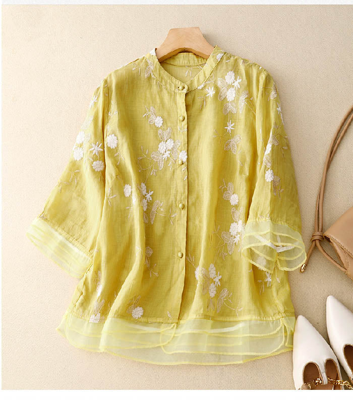 Ivory chic blouse with delicate floral embroidery, lightweight breathable fabric, relaxed sophisticated fit