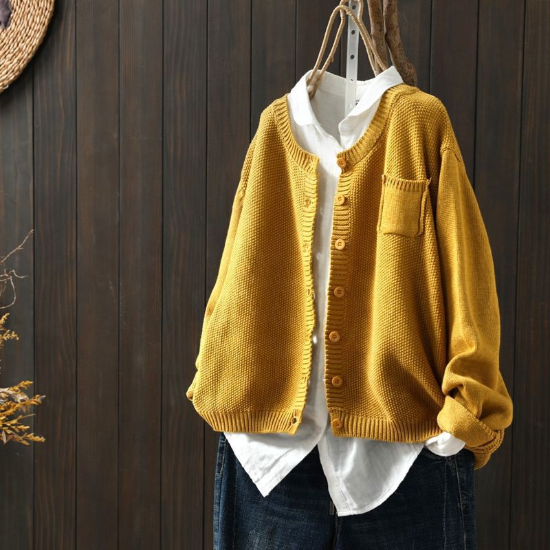 Women's beige relaxed-fit knit cardigan with front button detail, cozy layering essential